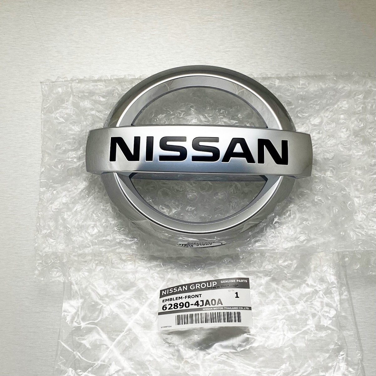 Logo Nissan Nissan Navara Mã phụ tùng 628904JA0A