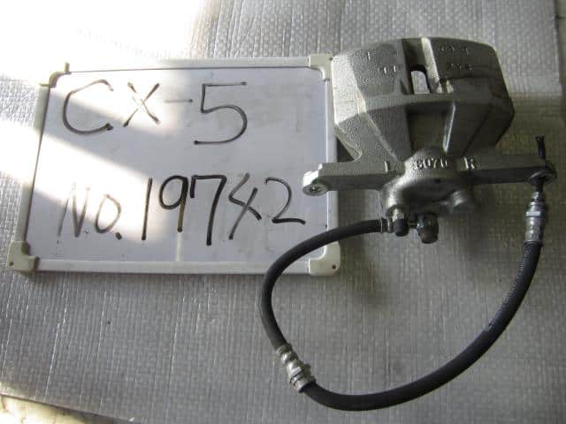 Cụm Đùm Phanh Trước Trái Mazda CX-5 Mã phụ tùng K0113371X