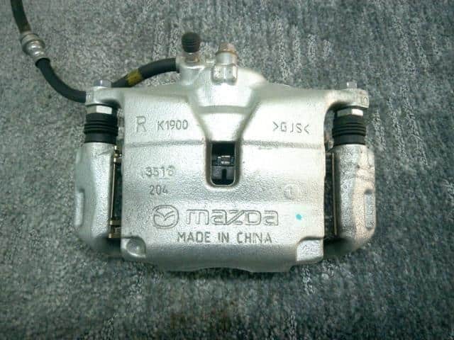 Cụm Gông Phanh Trước Phải Mazda Mazda 3 Mã phụ tùng B4Y03398ZB